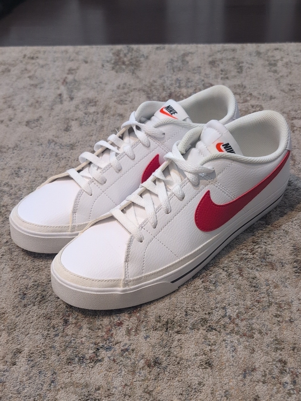 Nike Men’s White Sneakers with Red Swoosh.